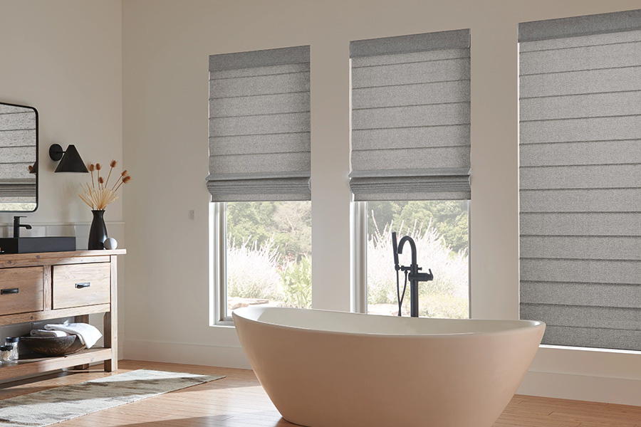 Gray Roman shades on bathroom windows